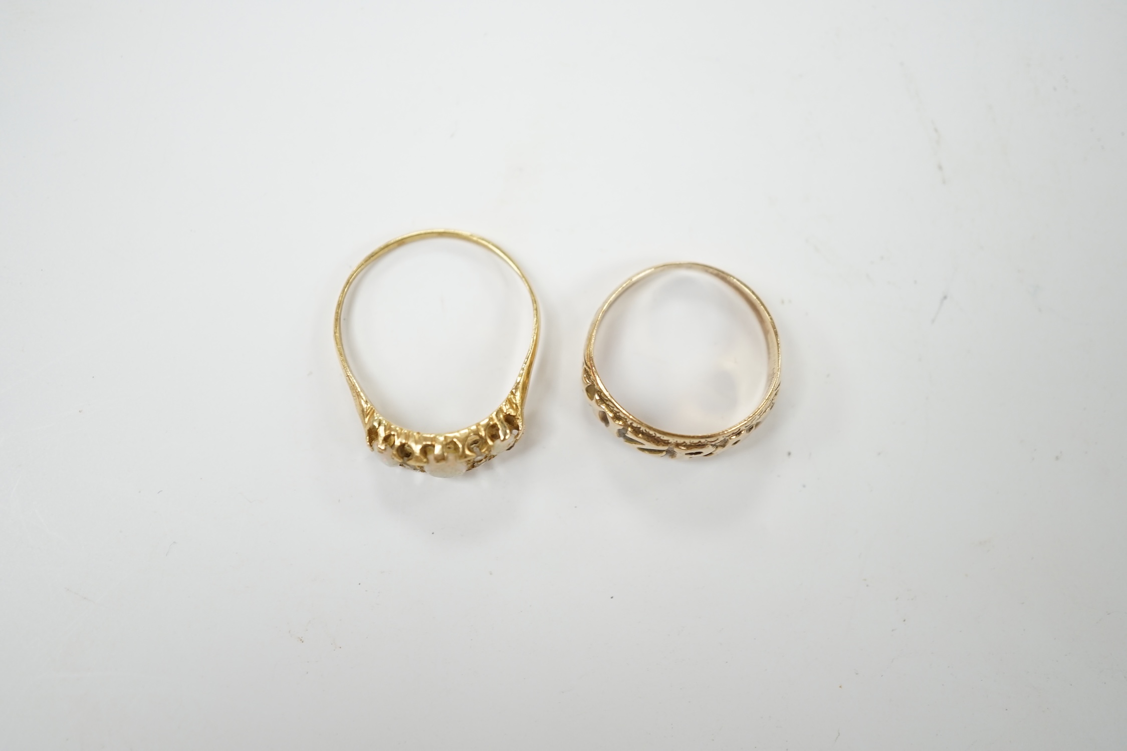 A 9ct gold 'Mizpah' ring and a yellow metal, three stone white opal set ring, with diamond chip spacers, size P, gross weight 5.2 grams. Condition - poor to fair